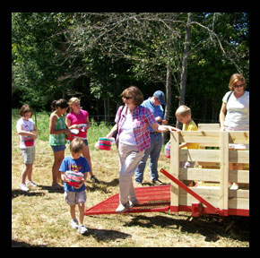 U-Pick wagon unloading at the Apple Orchard