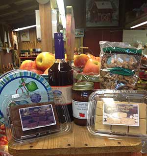 Farm store, apples and ciders, pies, caramel and candied apples, jams and jellies, bread, fritters,
		 cookbooks, candles